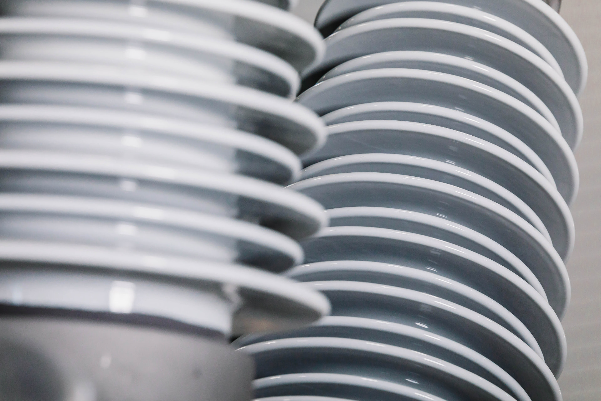 Close-up of grey porcelain high-voltage insulator sheds